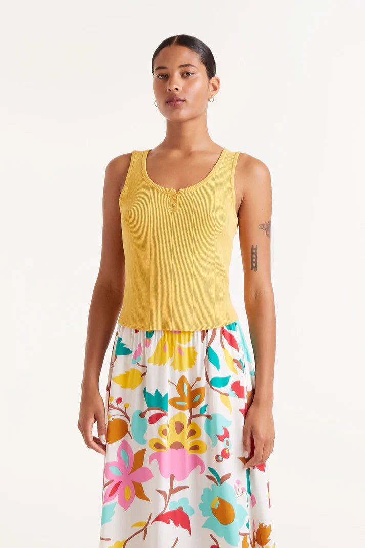 Maglia con bottoni gialli