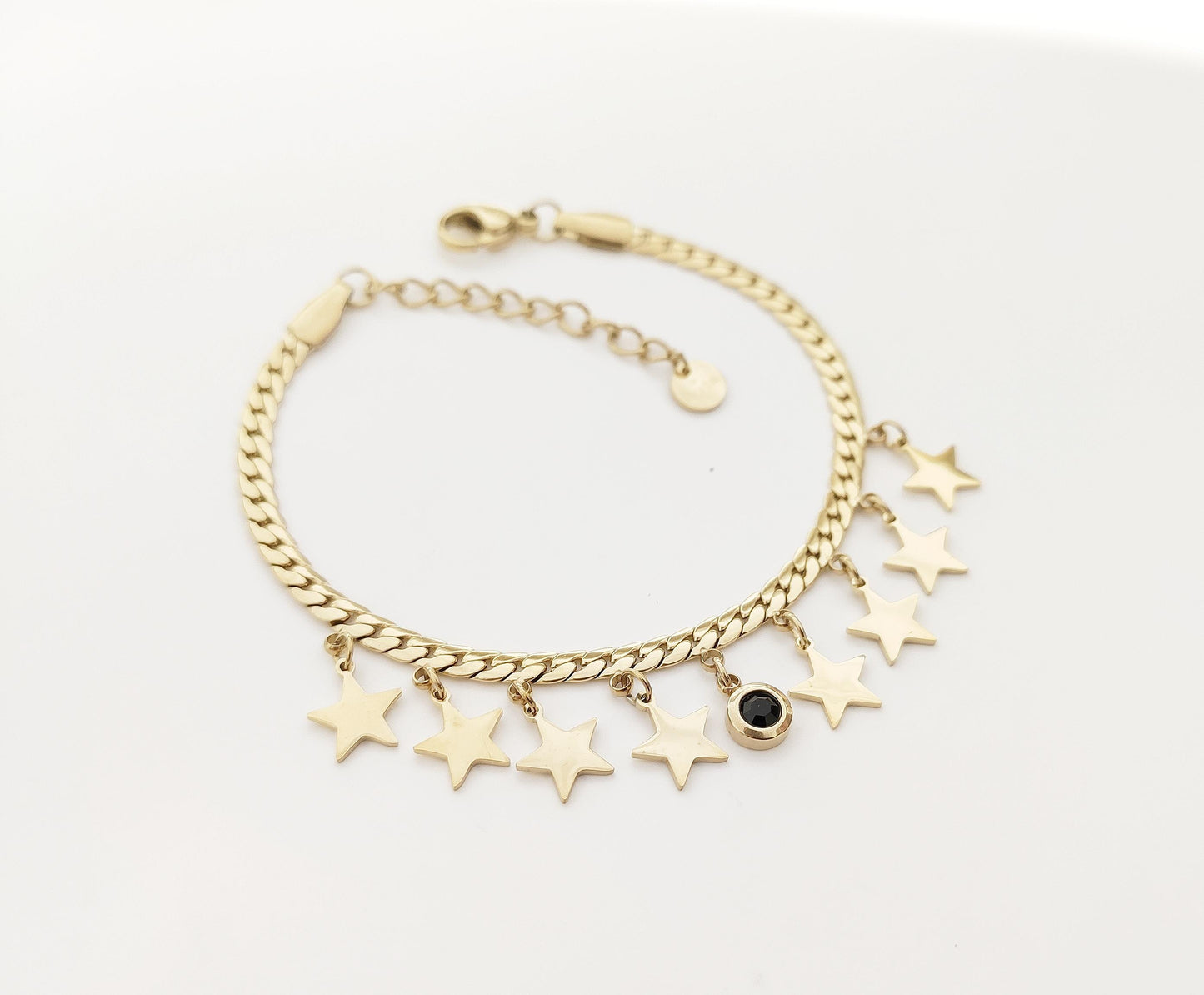Bracciale regolabile in acciaio con pendagli stelle e strass