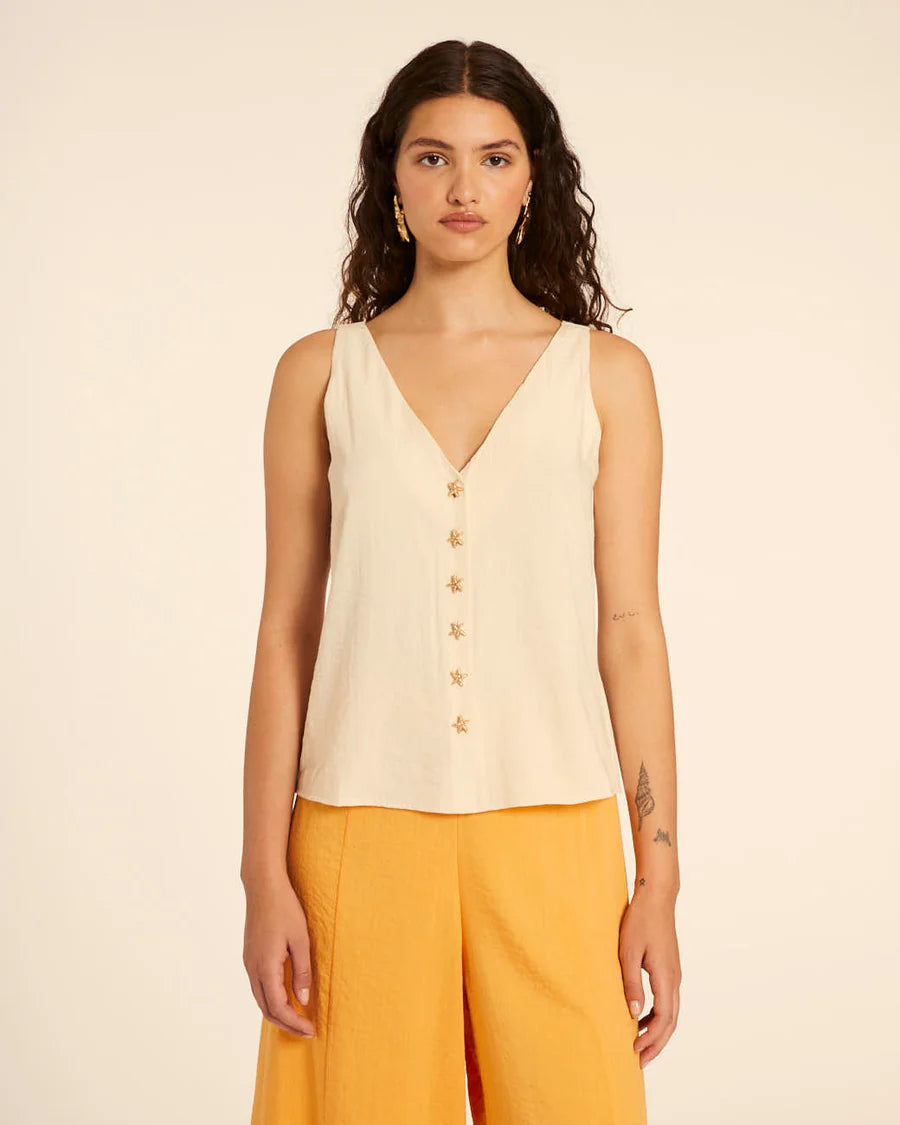 Top con bottoni a stella crema