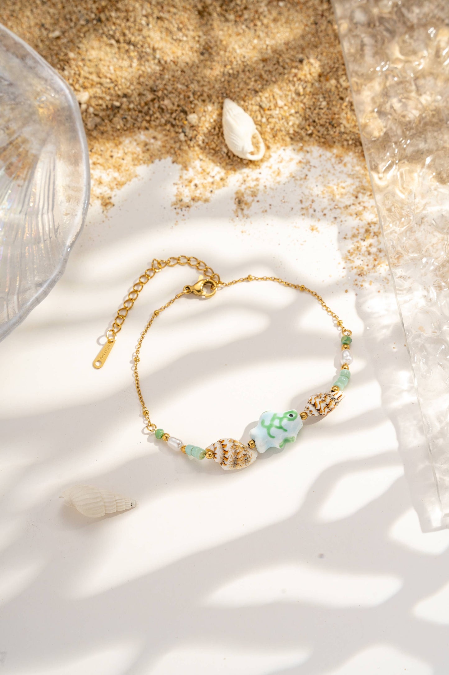Lotto da 12 braccialetti assortiti con charms marini turchese e conchiglia