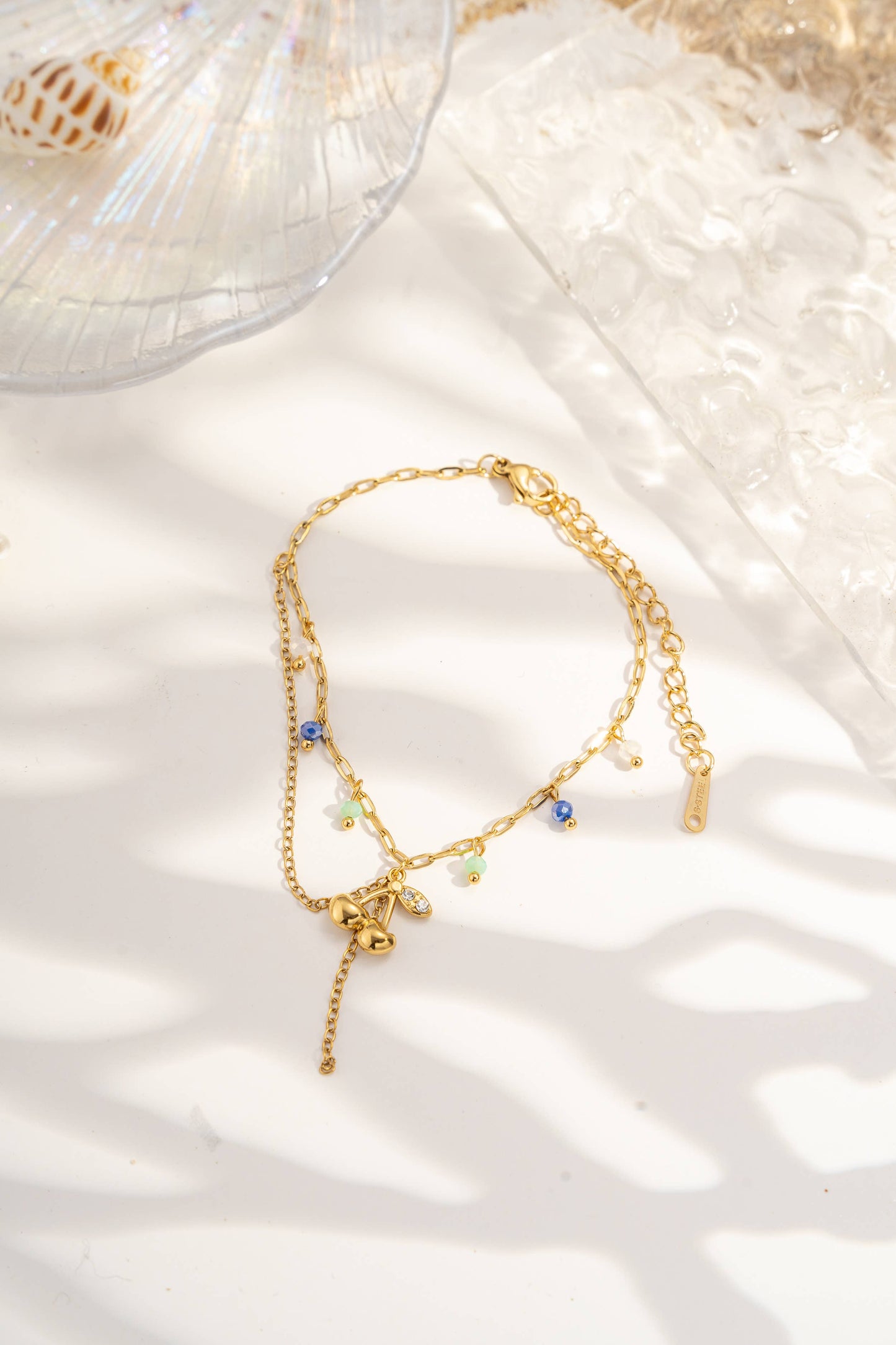 Lotto da 12 braccialetti assortiti con charms marini turchese e conchiglia