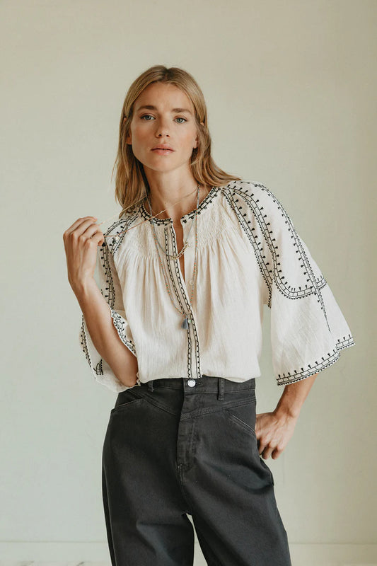 Blusa con ricami